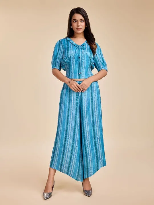 printed puff sleeve, ruffled  tie-up v neck corset top with smocking at the back with a comfortable flared pants set in viscose satin - Blue