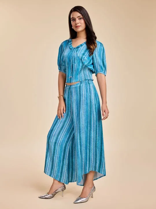 printed puff sleeve, ruffled  tie-up v neck corset top with smocking at the back with a comfortable flared pants set in viscose satin - Blue